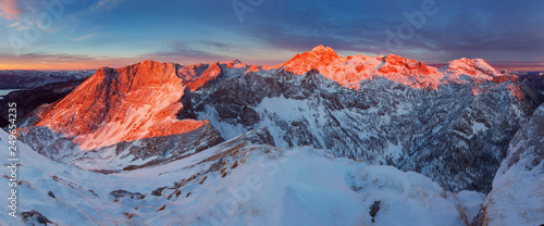 First snow and magnificent sunset in the mountains. Photo of amazing scene in European Alps. View to highest peak of Slovenia. Triglav National Park, Julian Alps Beautiful winter landscape with snow
