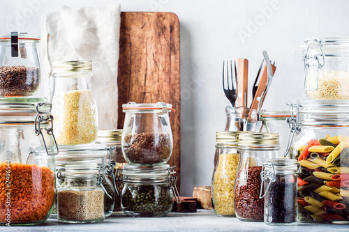 Cuadro en lienzo Stocks or set of cereals, pasta, groats, organic legumes and useful seeds in glass jars