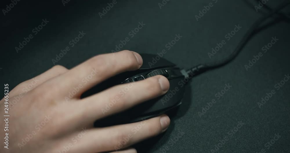 Desktop mouse clicking at computer with human hand closeup Desktop mouse clicking at computer with human hand closeup