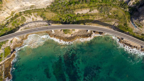 Travelling on the sea cliff bridge coastal drivel along the pacific ocean. Grand pacific drive, East coast of Australia. Clear sunny day.