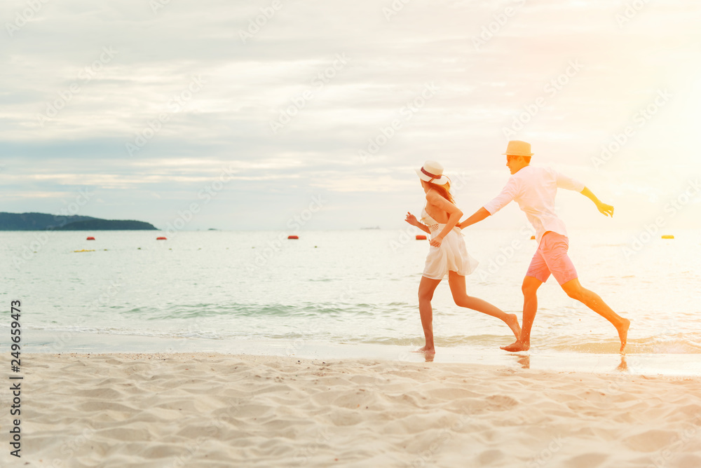 Romantic couple relaxing on the beach Romantic couple relaxing on the beach