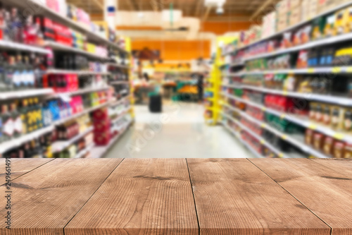 Empty wood table top on shelf in supermarket blurred background