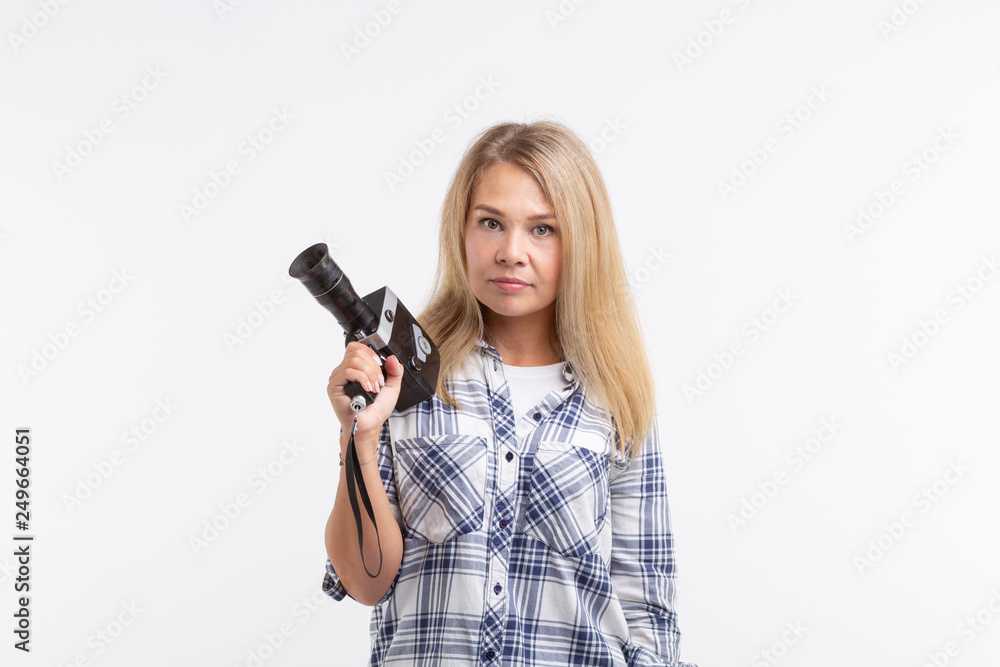 Technologies, photographing and people concept - blonde young woman with retro camera smiling over white background Technologies, photographing and people concept - blonde young woman with retro camera smiling over white background