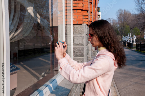 Russia, Khabarovsk, May 1, 2018: a girl takes pictures of the whale skeleton of the Khabarovsk Regional Museum. N.I. Grodekova photo