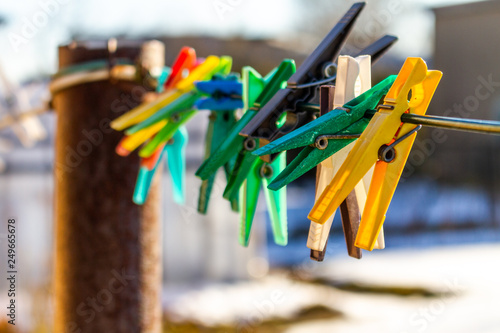 Colorful clothes pins isolated on a line in spring