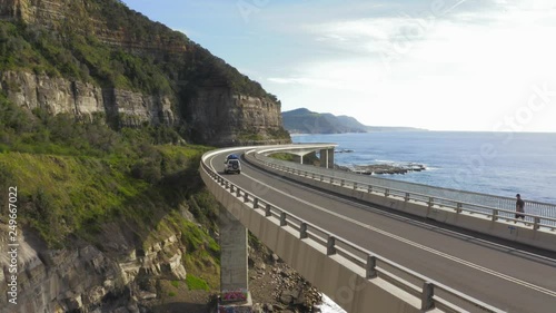 Sea cliff bridge. Coastal bridge which curves around the coast line and over the sea shore. Rugged Coastline.