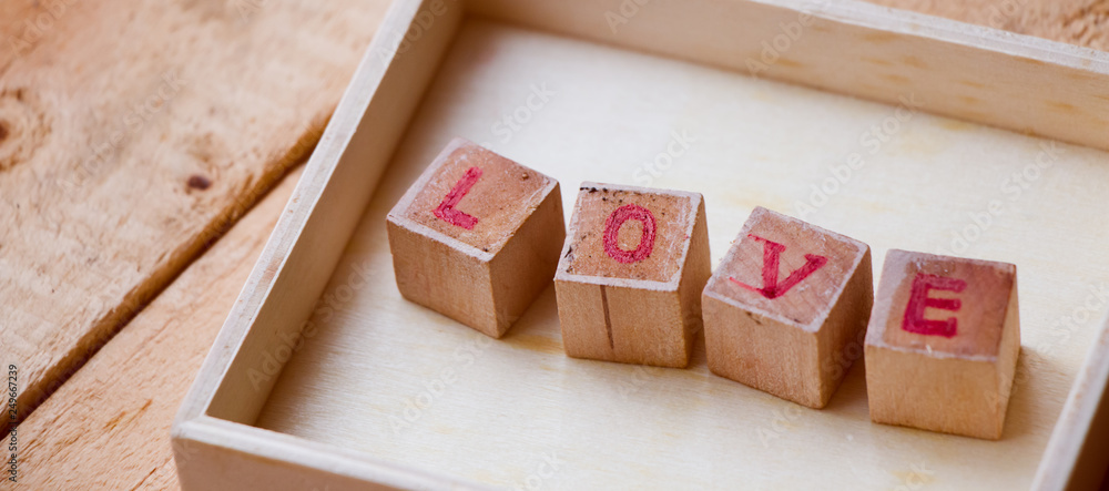 Close up LOVE text sign on wooden