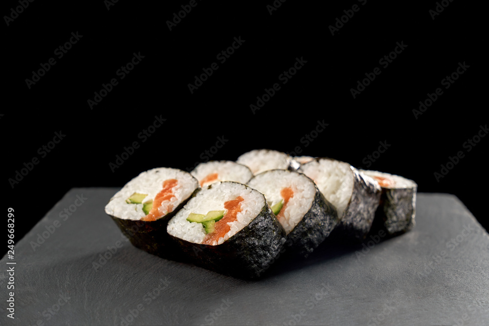 Maki sushi with cucumber and salmon. Maki sushi with cucumber and salmon.