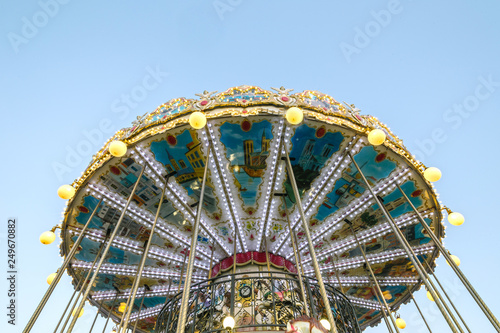 glowing carousel against the sky © stasknop