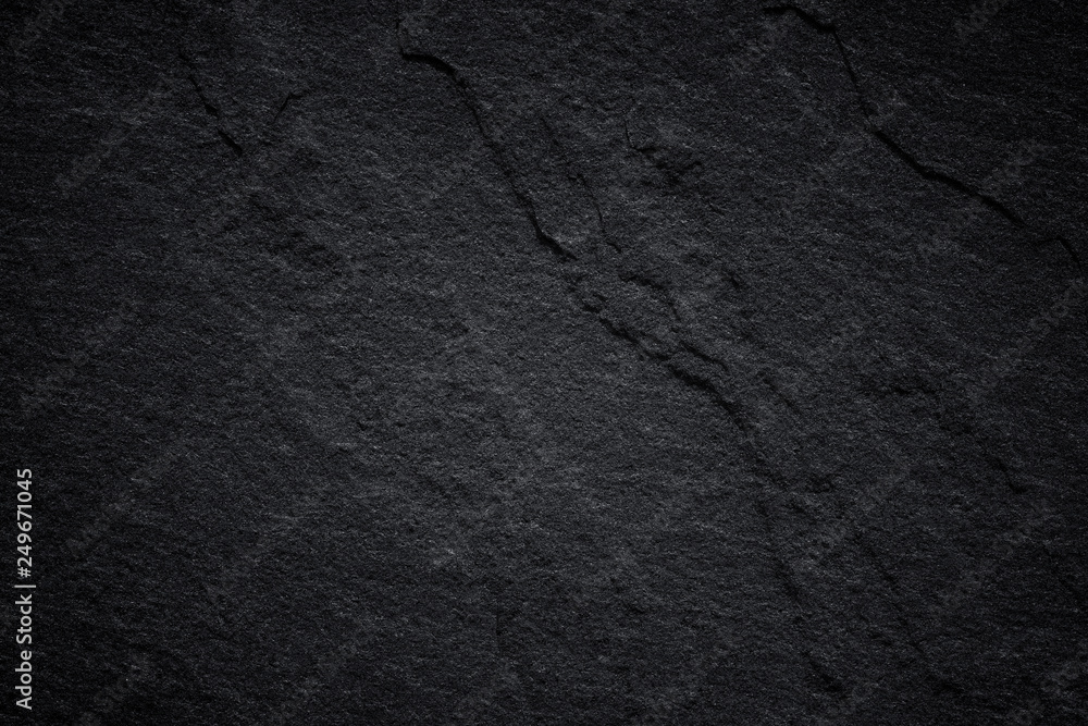 Dark grey black slate background or natural stone texture. Dark grey black slate background or natural stone texture.
