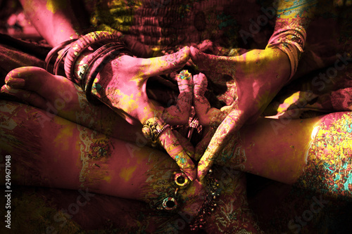 closeup of colorful woman hand in mudra gesture practice yoga outdoor photo