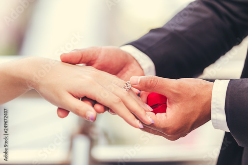 Business men surprise women with wedding rings © kasipat