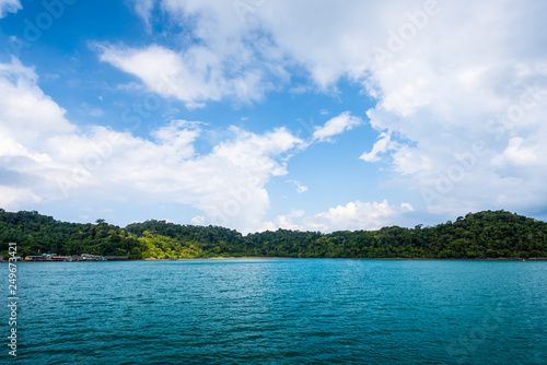 Sea and island on blue sky with cloud background