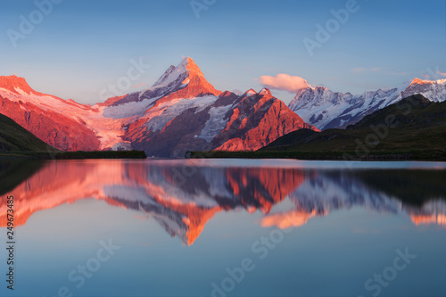 Beautiful evening panorama from Bachalp lake / Bachalpsee, Switzerland. Picturesque summer sunset in swiss Alps , Grindelwald, Bernese Oberland, Interlaken, Europe. Beauty of nature concept background © Michal