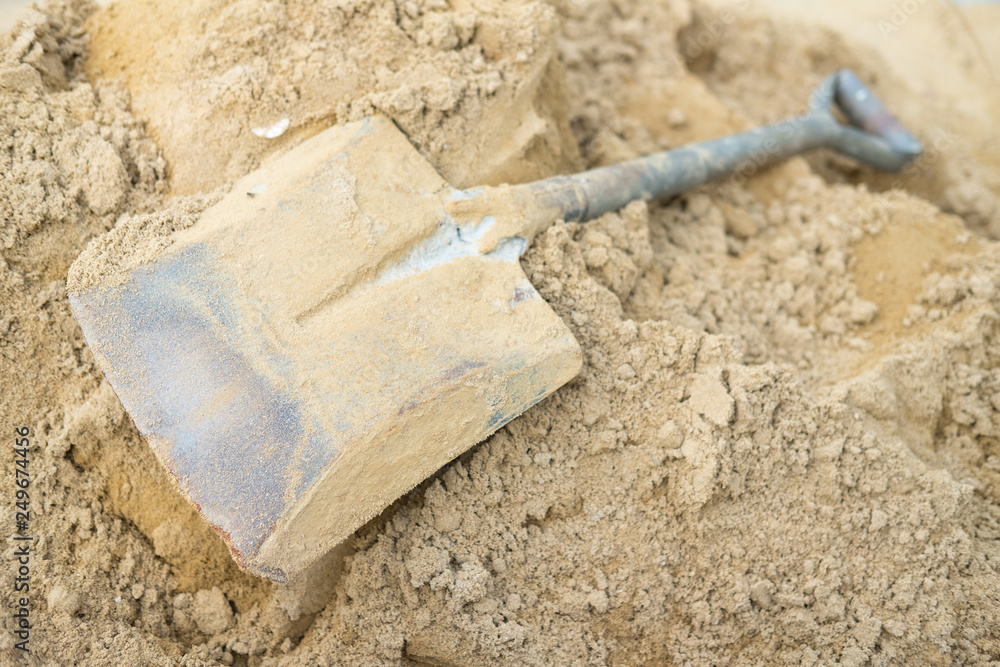 Shovel on a pile of sand for construction work