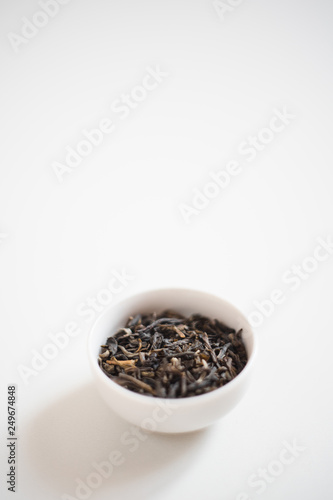 chinese tea in a drinking bowl on white background 