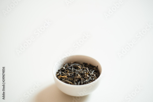 chinese tea in a drinking bowl on white background 