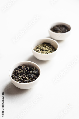 the white drinking bowls of chinese tea in order  on white background