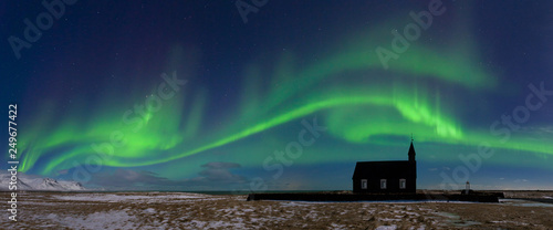 Fotografie Aurora borealis above the church