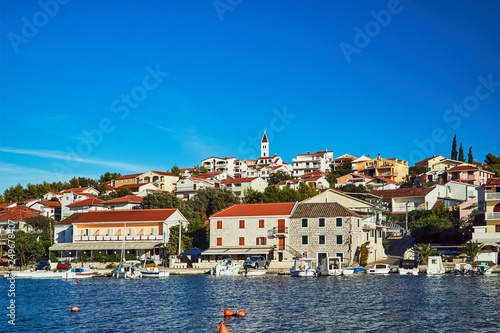 Boats and sailboats in the marina in the city of Seget Vranjica in Croatia.