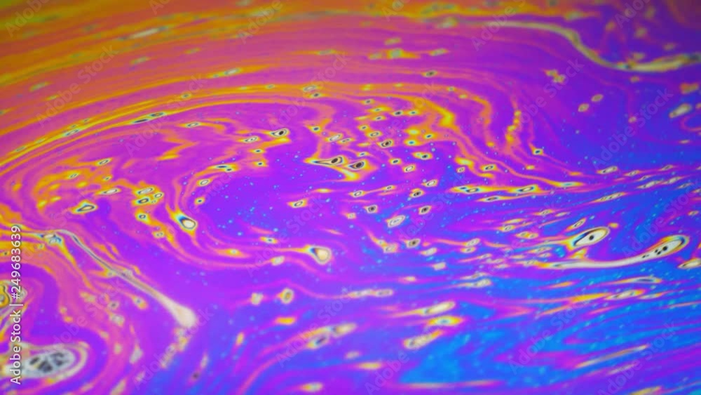 Psychedelic background of motion surface of colorful soap bubble Psychedelic background of motion surface of colorful soap bubble