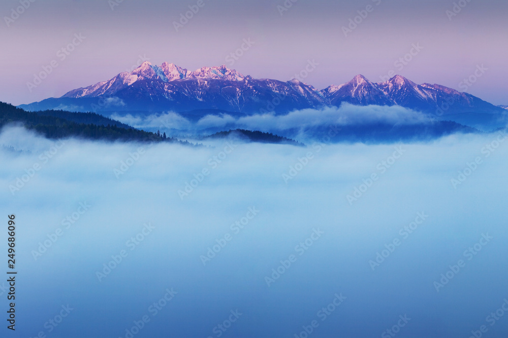 Scenic Landscape view with Soft light in morning beautiful sunrise, cloudy and foggy sea of wave fog look like around the mountain at High Tatras, Slovakia. beautiful landscape of the mountain