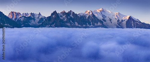 Views of the Mont Blanc glacier above the clouds. Popular tourist attraction. Picturesque and gorgeous scene. Location place Nature Reserve Aiguilles Rouges, Graian Alps, France, Europe. Beauty world.