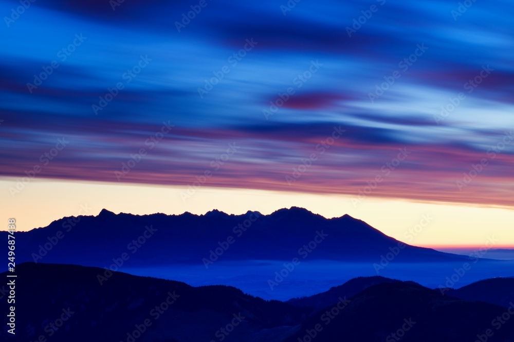 Obraz premium Scenic Landscape view with Soft light in morning beautiful sunrise, cloudy and foggy sea of wave fog look like around the mountain at High Tatras, Slovakia. beautiful landscape of the mountain 
