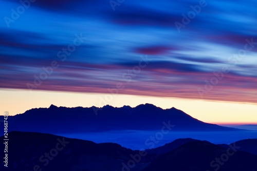 Scenic Landscape view with Soft light in morning beautiful sunrise, cloudy and foggy sea of wave fog look like around the mountain at High Tatras, Slovakia. beautiful landscape of the mountain  photo