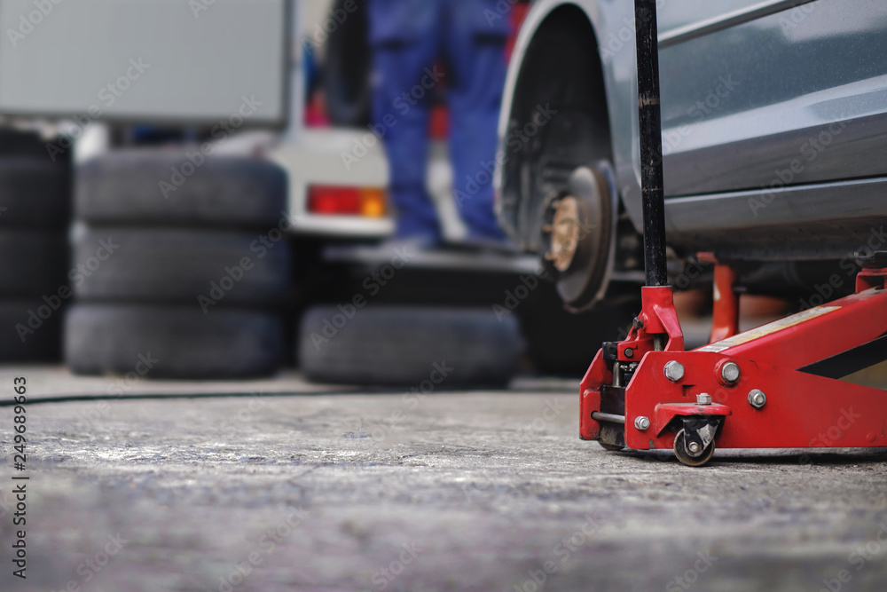 Naklejka premium Tire Replacement concept. Garage' Tools and Equipment. Car Maintenance and services