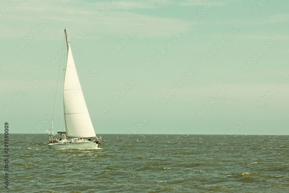 Lonely Sailboat Yacht at sea.