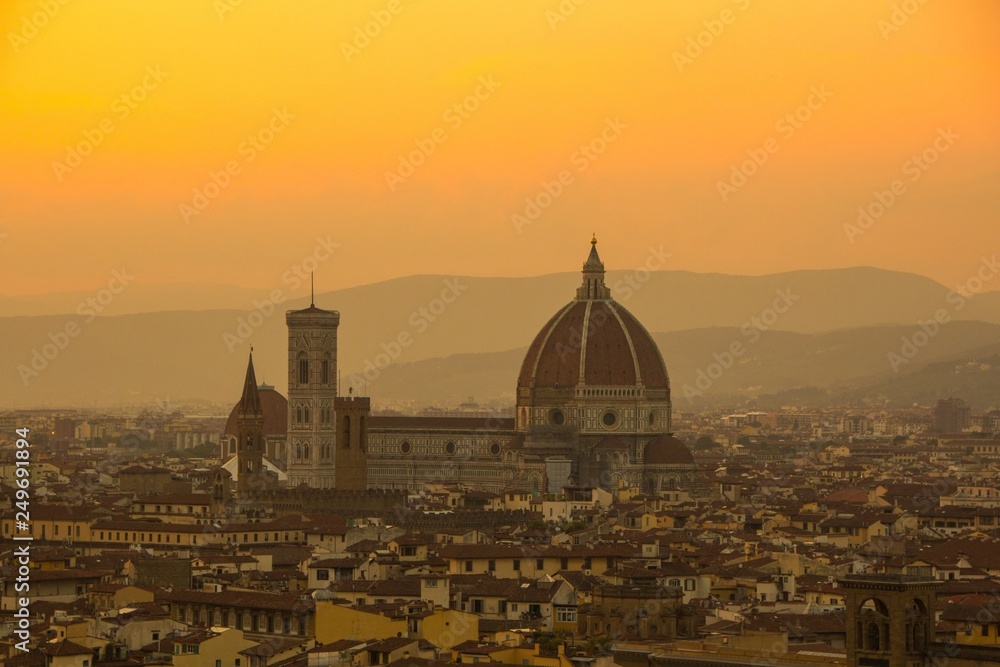 Cathedral of Santa Maria del Fiore (Duomo). Amazing evening golden hour light. View from Piazzale Michelangelo. Beautiful gold sunset in Florence, Italy.
