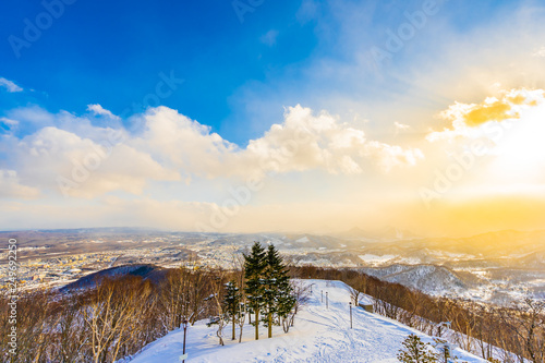 Beautiful landscape with mountain around tree in snow winter season at sunset time