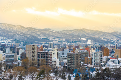 Beautiful architecture building with mountain landscape in winter season at sunset time