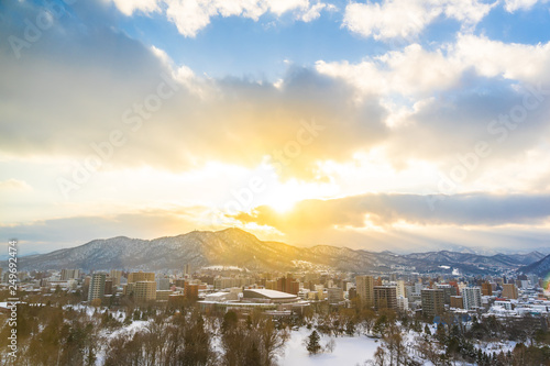 Beautiful architecture building with mountain landscape in winter season at sunset time