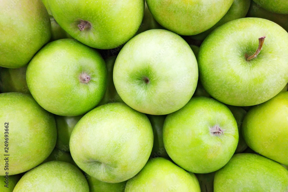 Juicy green apple background. Close up top view photography Juicy green apple background. Close up top view photography