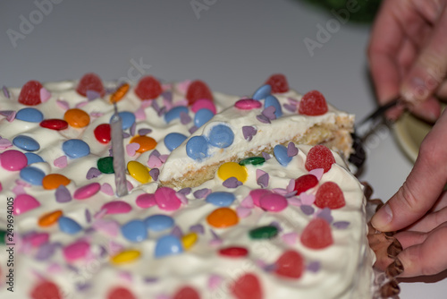 birthday cake with cream and lots of candy
