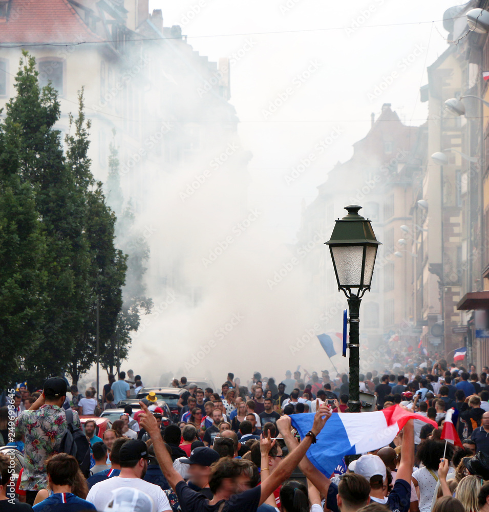 crowd celebrating in the street in France