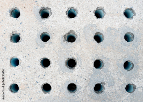 Drain cover made of cement with many PVC pipe for evaporation of pressure from the drain.