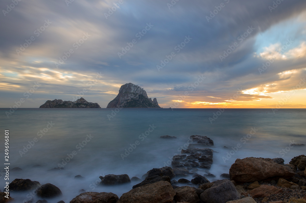 The island of Es Vedra in long exposure at sunset The island of Es Vedra in long exposure at sunset