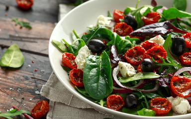 Sun dried tomatoes Salad with fresh vegetables mix and mozzarella cheese. healthy food