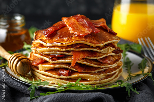 Pancakes with crispy bacon and maple syrup in a plate. Morning Breakfast
