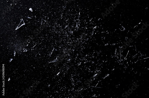 Explosion glass, dust and piece texture and background, isolated on black, cracked window effect 
