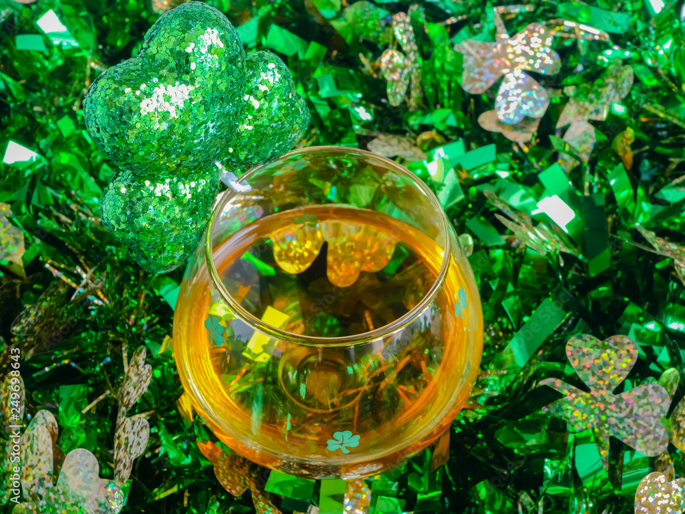 St Patricks Day Irish Whiskey Glass with Shamrock and TInsel Close up