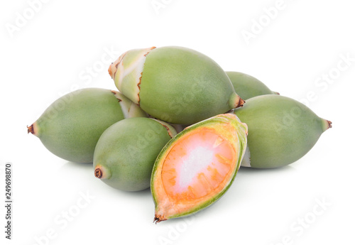 raw betel nut fruit with half cut isolated on white background photo