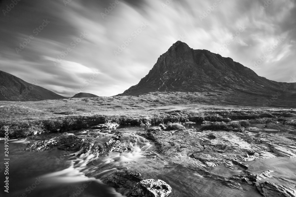 Obraz premium View towards Rannoch Moor, River Coupall in foreground, Beinn a' Chrulaiste on left. Highland, Scotland, UK. The mountain is Buachaille Etive Mor. It is located in Glencoe in the Lochaber region