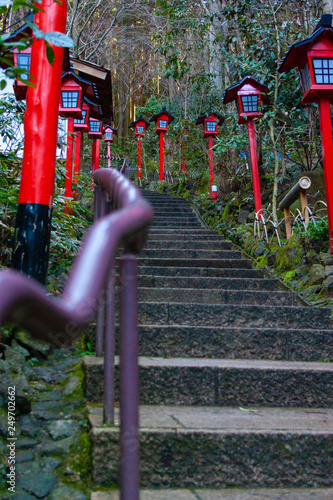 Purple handrails and red lanterns in Japanese temple  photo