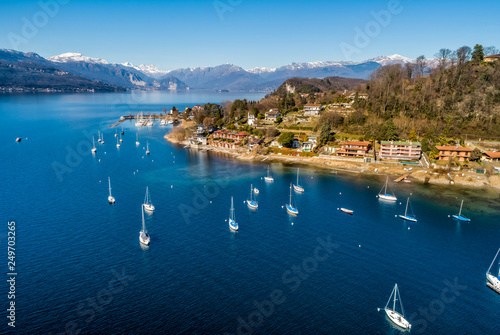 Obraz na płótnie Aerial view of Lake Maggiore with boats in the harbor of Monvalle village, provi