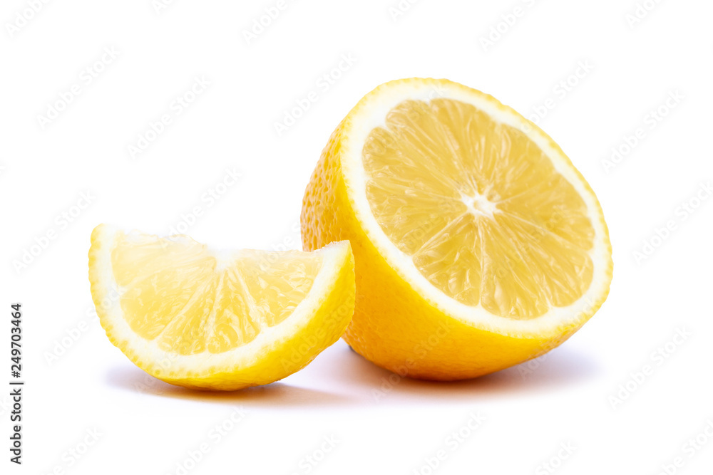 Isolated half and slice of juicy yellow lemon on white background Isolated half and slice of juicy yellow lemon on white background