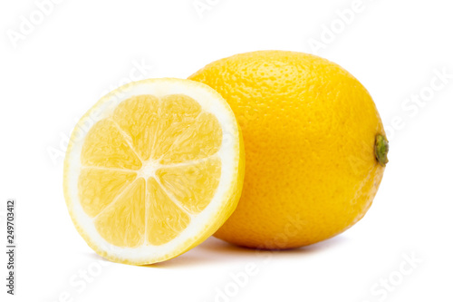 Isolated whole and slice juicy lemon on white background